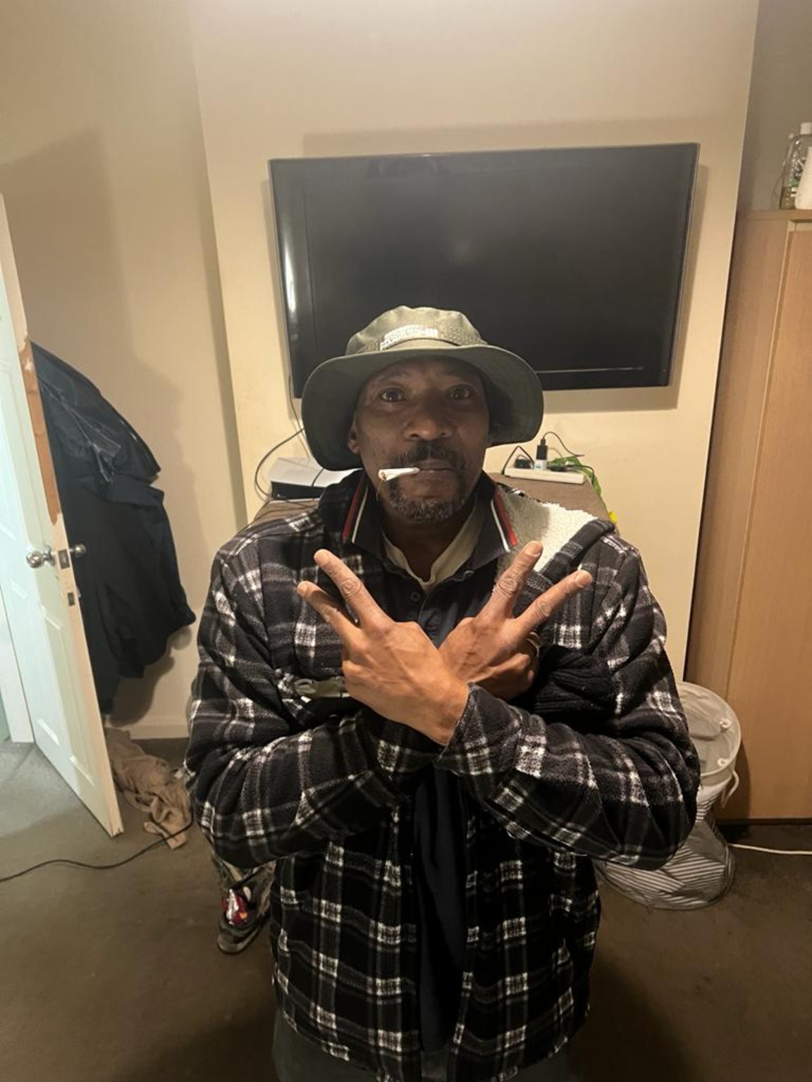 Stephen Hilton wearing a hat and jacket